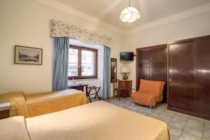 Postel nebo postele na pokoji v ubytování Hotel Primavera