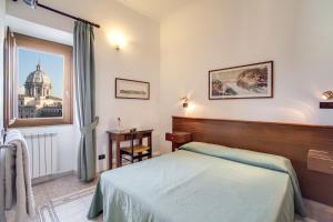 Postel nebo postele na pokoji v ubytování Hotel Primavera