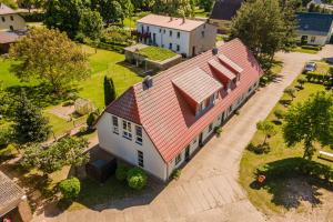 an overhead view of a house with a red roof at Ferienappartement Müritzkoje in Vipperow