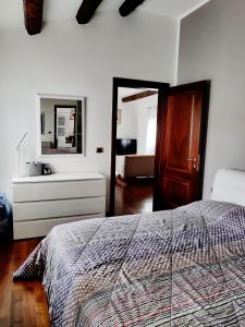 Ένα ή περισσότερα κρεβάτια σε δωμάτιο στο Casa Pampi MyTravelChioggia