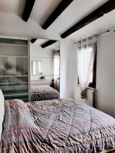 Ένα ή περισσότερα κρεβάτια σε δωμάτιο στο Casa Pampi MyTravelChioggia
