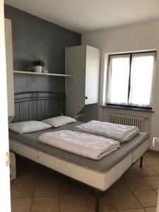 Postel nebo postele na pokoji v ubytování Appartamento Torilla