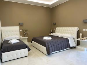 Katil atau katil-katil dalam bilik di Pompei via Roma Suite