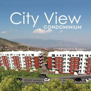 a view of a city with red and white buildings at City View Condominium in Skopje