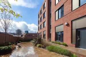 a brick building with a courtyard in front of it at For Students Only City Living Modern Studios at Hannah Court in Sheffield in Sheffield