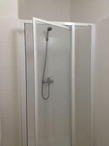 a shower with a shower head in a bathroom at Apt. overlooking the castle Nižbor20km from Prague in Nižbor