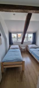 Postel nebo postele na pokoji v ubytování Apartament Przystań