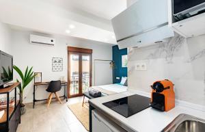 A television and/or entertainment centre at Oleti Studio Granada