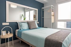 A bed or beds in a room at Oleti Studio Granada