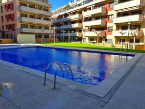 Swimmingpoolen hos eller tæt på Maravilloso piso con piscina a 200m de la playa