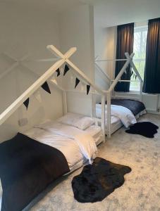 a bedroom with two beds in a room at The Secret Garden in Cheadle