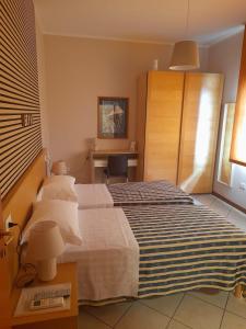 Postel nebo postele na pokoji v ubytování vasco rent rooms