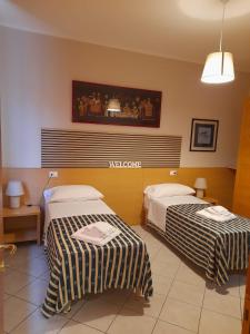 Postel nebo postele na pokoji v ubytování vasco rent rooms