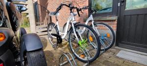 a bike is parked in front of a door at Fitness loft 50 m2 in Zemst +7 photos