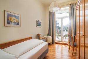 Postel nebo postele na pokoji v ubytování Villa Bavaria
