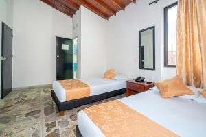 Postel nebo postele na pokoji v ubytování Hotel Barcelona Estadio