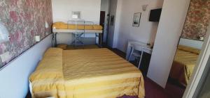 Postel nebo postele na pokoji v ubytování Hotel Igea Spiaggia