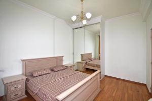 a bedroom with a bed and a large mirror at Argishti Street, 2 bedrooms Comfortable apartment GL152 in Yerevan