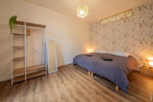 Posteľ alebo postele v izbe v ubytovaní Ma Location Gaillacoise - APPARTEMENT TOUT CONFORT - HYPERCENTRE - 58m2 - GAILLAC