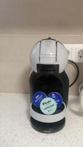 a coffee pot sitting on a counter with stickers on it at Irini's house with Jacuzzi in Dhragoulás