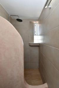 a bathroom with a shower with a toilet and a sink at Irini's house with Jacuzzi in Dhragoulás +36 photos