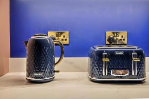 two toasters sitting on top of a table at Finest Retreats - Castle House Nottingham - Luxurious Hot Tub Stay in Nottingham