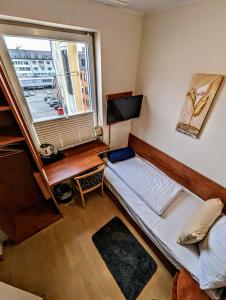 Postel nebo postele na pokoji v ubytování Hotel am Rathaus