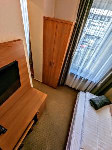 Postel nebo postele na pokoji v ubytování Hotel am Rathaus