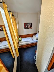Postel nebo postele na pokoji v ubytování Hotel am Rathaus