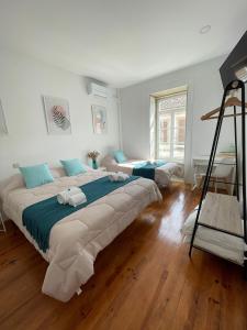 a large bedroom with a large bed and a ladder at Centro da Vila in Ponte de Lima +51 photos
