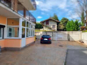 a car parked in a parking lot next to a building at Apartma Piko in Koper