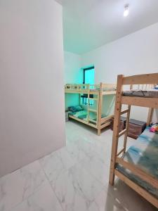 a room with two bunk beds and a mirror at Abu Dhabi Center - Unique Bed Space in Abu Dhabi