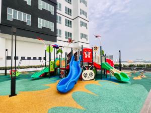 a playground in front of a building at New l 2BR I 2-6Pax I Jonker 5 Min I SeaView I AmberCove in Melaka