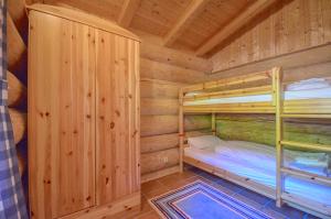 Postel nebo postele na pokoji v ubytování Chalet Stabler - by Alpen Apartments