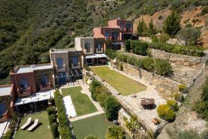 an aerial view of a house on a mountain at Wonderful maisonette overlooking the Aegean Sea in Petriaí
