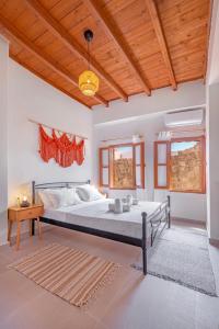 a bedroom with a bed and a wooden ceiling at Casa Della vita apartment ,Old Town Rhodes in Rhodes Town