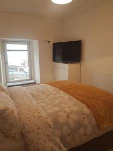 Postel nebo postele na pokoji v ubytování Wee Harbour View + 7 fotografií