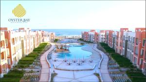 an aerial view of a city with buildings at Oyster Bay Resort, One Bedroom Beach Front Apartment, Marsa Alam in Abu Dabab