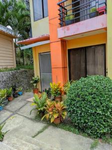 a building with a bunch of plants in front of it at 2BR 2BT home with pool between Tagbilaran and Panglao in Dauis