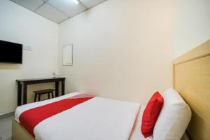 Postel nebo postele na pokoji v ubytování Hotel River Inn