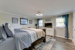 a bedroom with a bed and a television at Pet-Friendly Lexington Vacation Rental on Lake! in Lexington