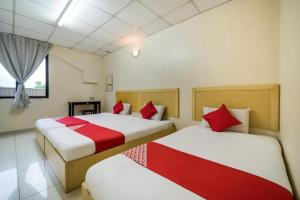Postel nebo postele na pokoji v ubytování Hotel River Inn