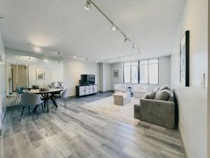 a living room with a couch and a table at The Hartford Skyline Downtown Hartford XL Center in Hartford