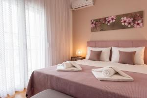 Posteľ alebo postele v izbe v ubytovaní Blue Ark Boho Stay at Acropolis
