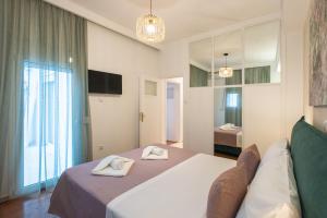 Posteľ alebo postele v izbe v ubytovaní Blue Ark Boho Stay at Acropolis