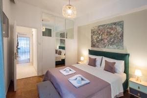 Posteľ alebo postele v izbe v ubytovaní Blue Ark Boho Stay at Acropolis