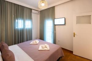 Posteľ alebo postele v izbe v ubytovaní Blue Ark Boho Stay at Acropolis