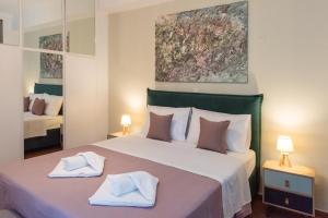 Posteľ alebo postele v izbe v ubytovaní Blue Ark Boho Stay at Acropolis