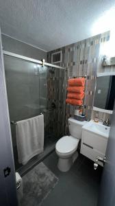 A bathroom at Newly Renovated Modern Apartment in San Juan Center with Backup Electricity and Gated Security 602