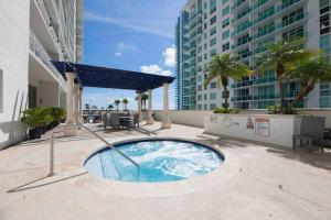 a small swimming pool on a balcony of a building at Ocean View Amazing Unit Brickell in Miami